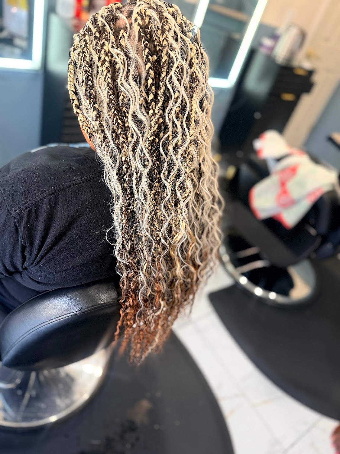 Honey-blonde boho braids with curly ends