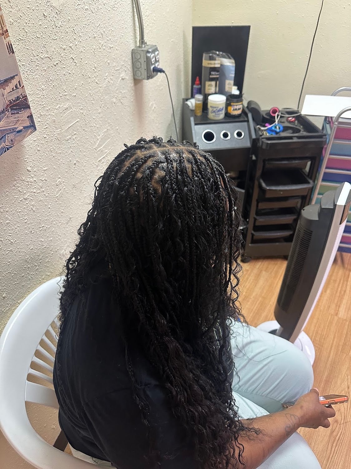 Knotless braids left curly from the mid-length down