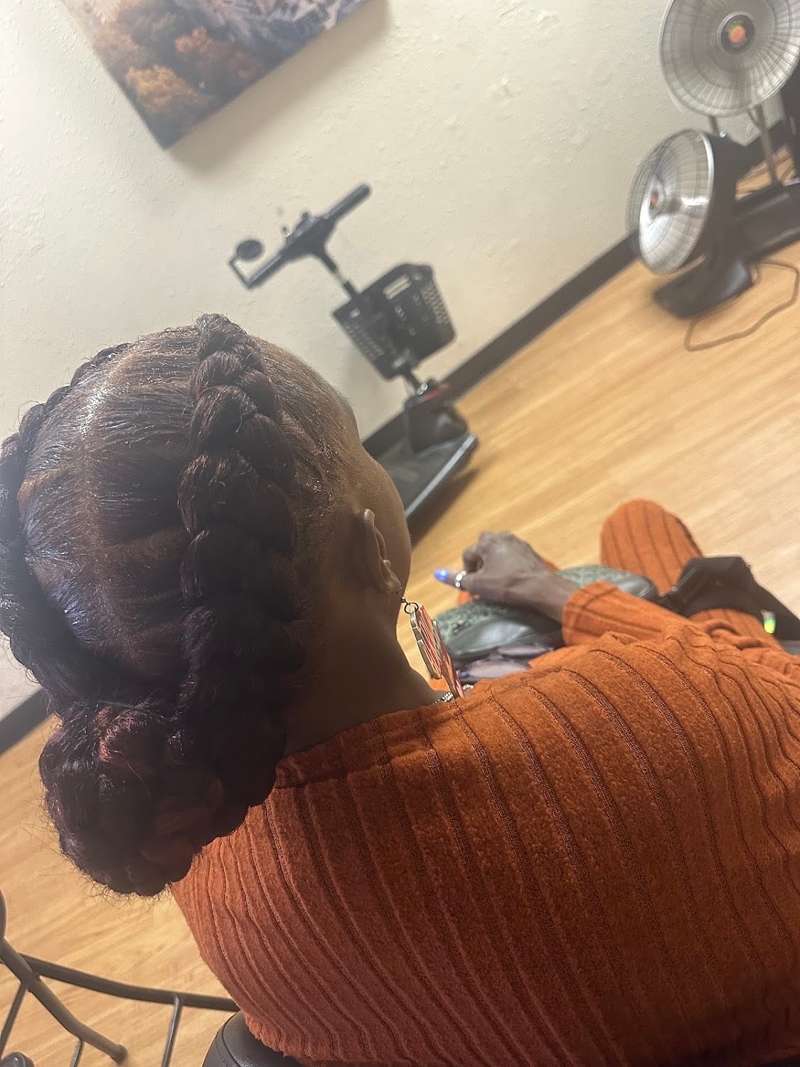 Braided hair swept into a smooth low bun